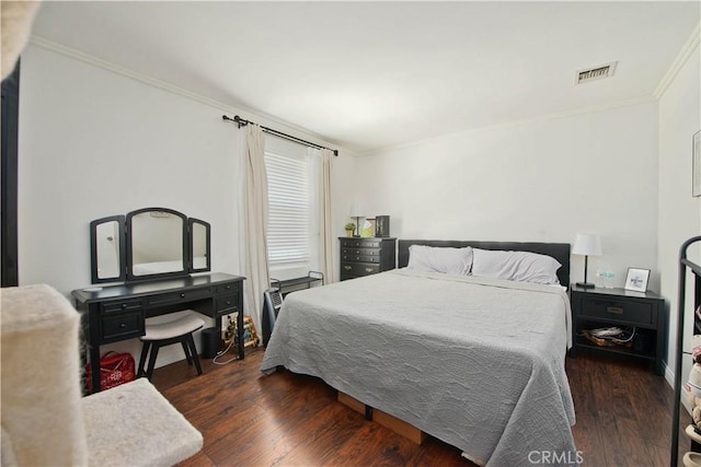 bedroom featuring dark hardwood / wood-style floors and ornamental molding