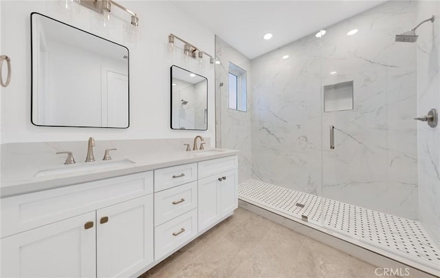 bathroom featuring vanity and a shower with shower door