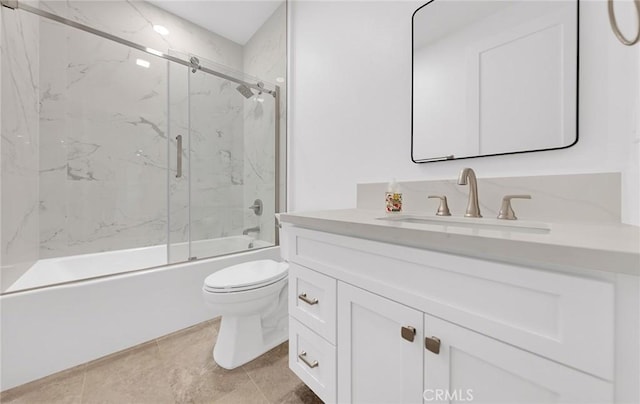 full bathroom with enclosed tub / shower combo, vanity, and toilet