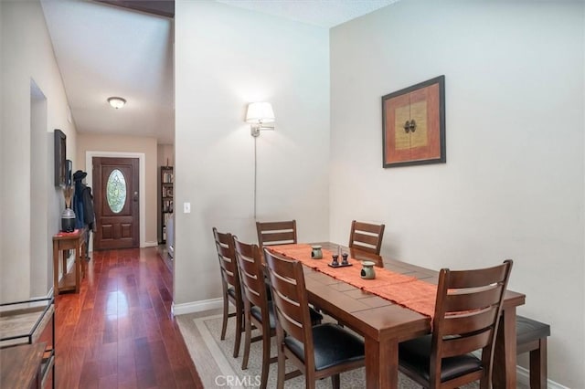 dining space featuring dark hardwood / wood-style flooring