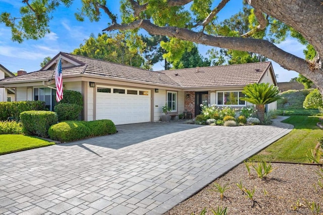 ranch-style home featuring a garage