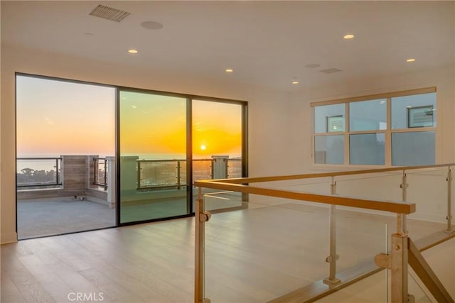 spare room with light hardwood / wood-style floors