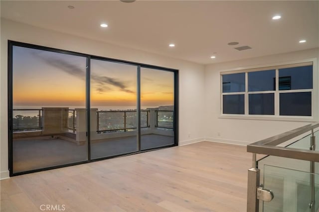 unfurnished room featuring light hardwood / wood-style floors