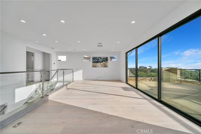 unfurnished room with light hardwood / wood-style floors