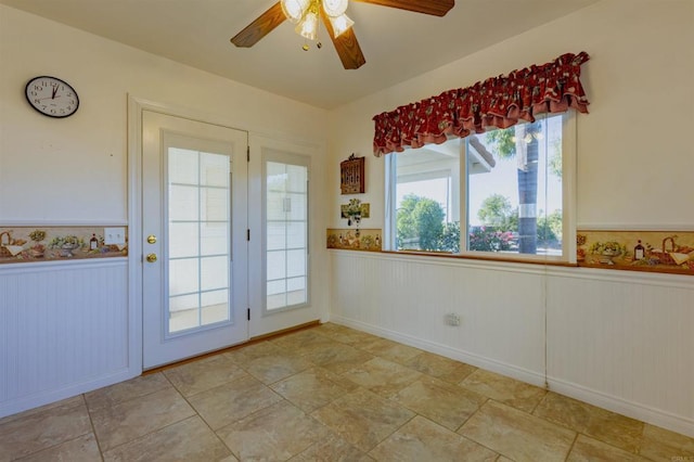 doorway to outside with ceiling fan