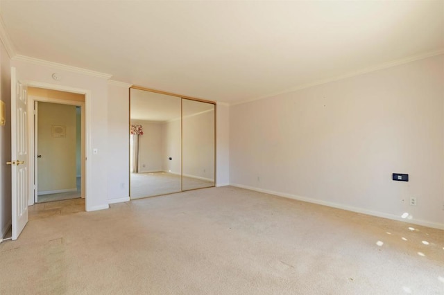 carpeted empty room with crown molding