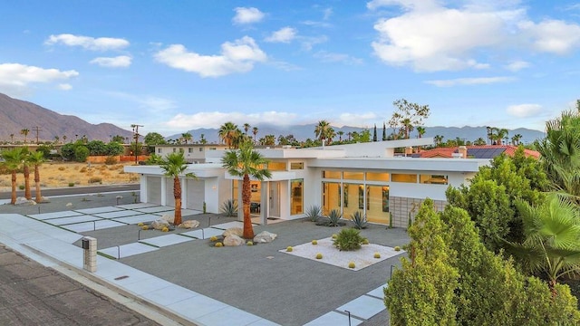 exterior space featuring a mountain view and a garage