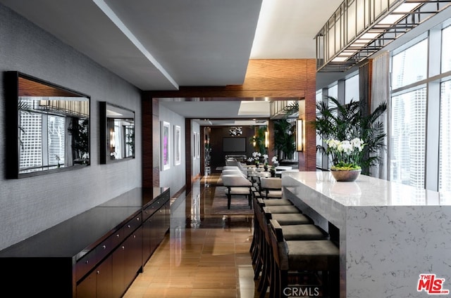 interior space featuring hardwood / wood-style floors and dark brown cabinets