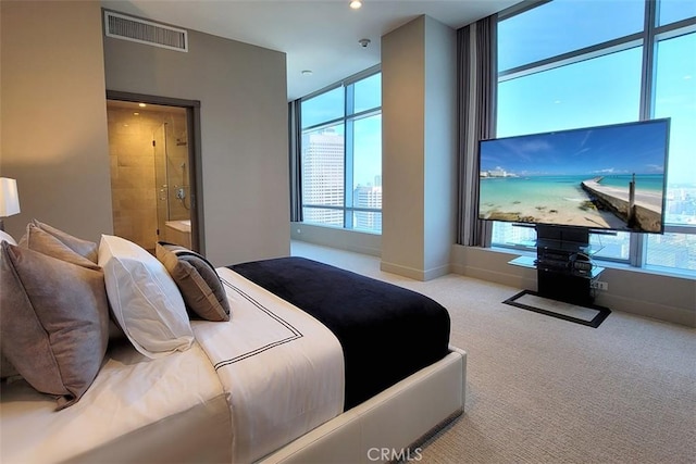 bedroom featuring light colored carpet