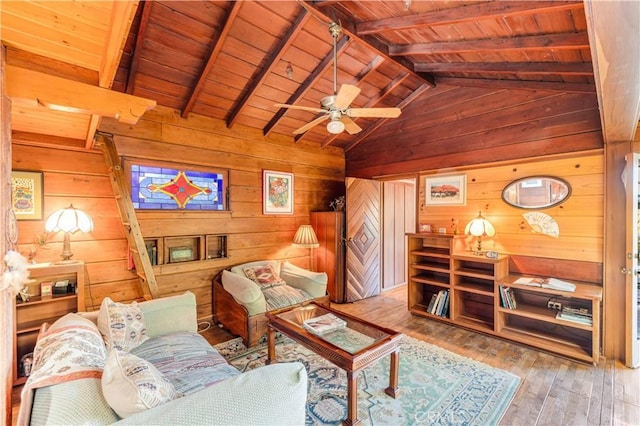 living room with hardwood / wood-style flooring, vaulted ceiling with beams, wood ceiling, and wood walls