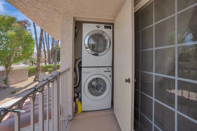 laundry area with stacked washer / drying machine