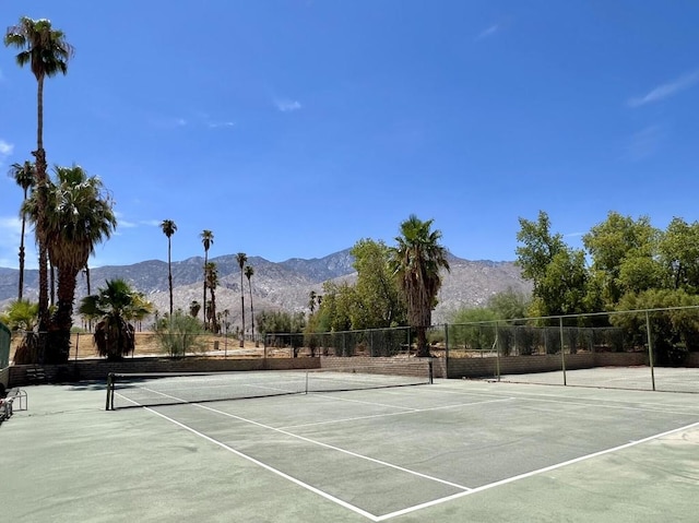 view of sport court with a mountain view