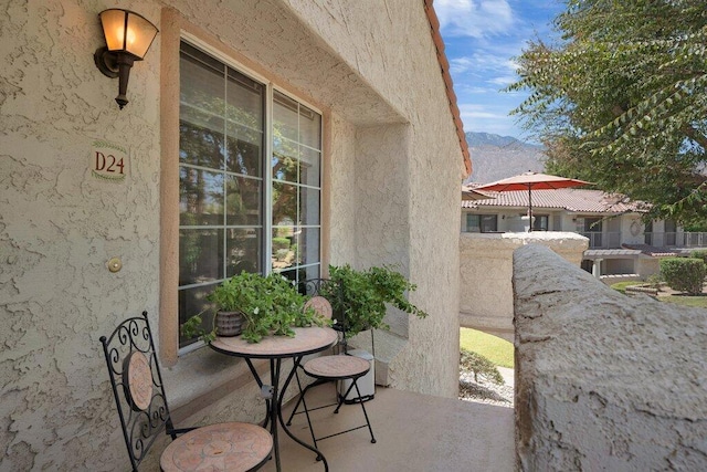 view of patio / terrace with a mountain view