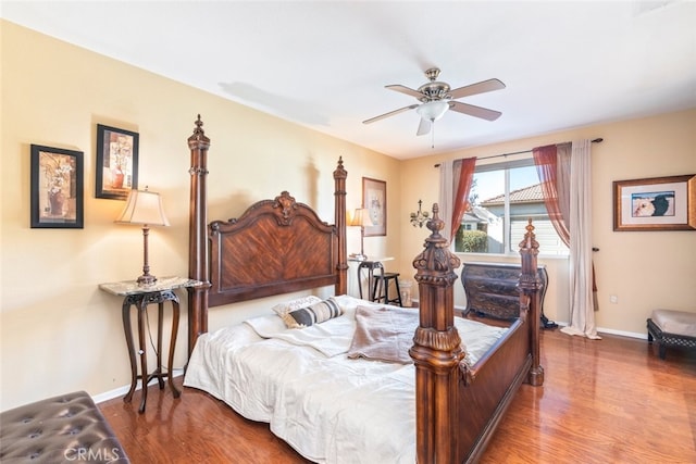 bedroom featuring hardwood / wood-style floors and ceiling fan