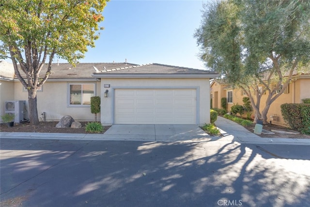 single story home featuring a garage