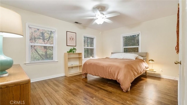 bedroom featuring hardwood / wood-style floors and ceiling fan