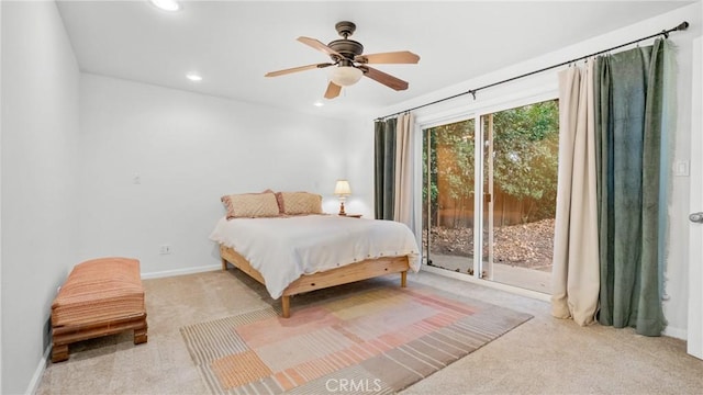 bedroom with access to exterior, ceiling fan, and light colored carpet