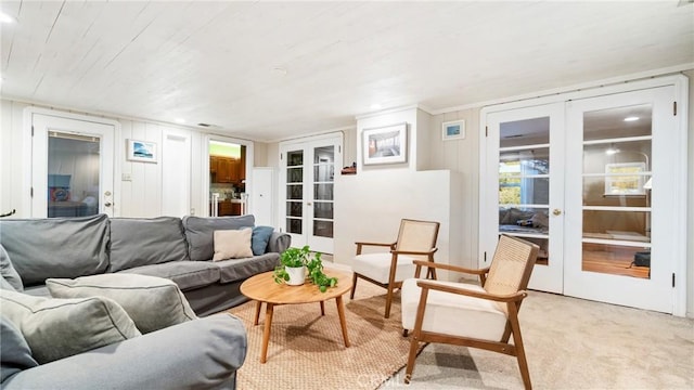 carpeted living room featuring french doors