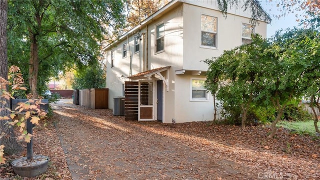 view of side of home featuring central air condition unit