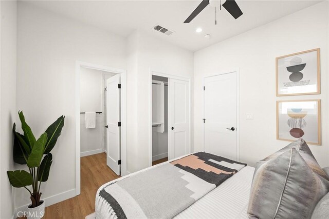 bedroom with light wood-type flooring and ceiling fan