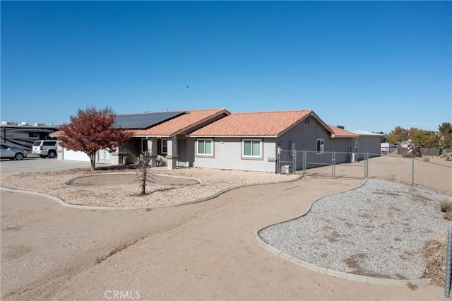 view of front of house featuring solar panels