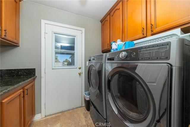 washroom with cabinets and separate washer and dryer