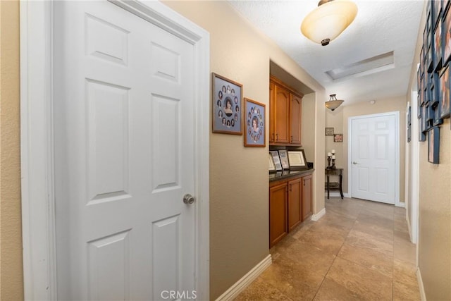 hallway featuring light tile patterned floors