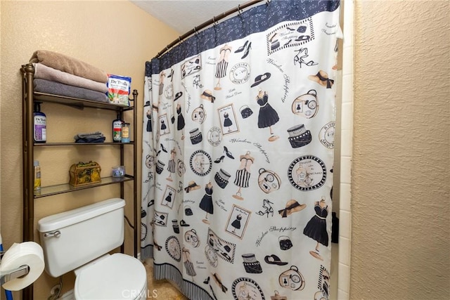 bathroom with toilet and a shower with shower curtain