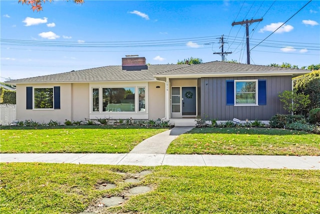 single story home featuring a front yard