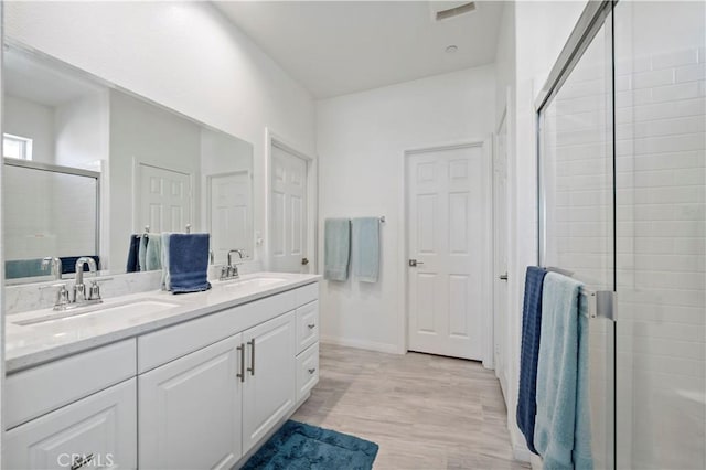 bathroom featuring vanity and walk in shower