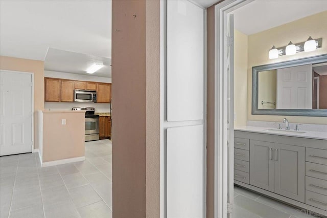 bathroom featuring tile patterned floors and vanity