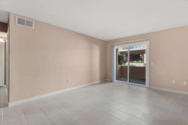 empty room featuring light tile patterned flooring