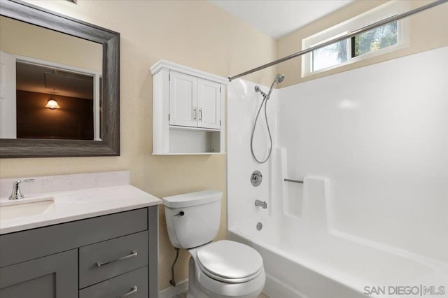 full bathroom featuring bathtub / shower combination, vanity, and toilet