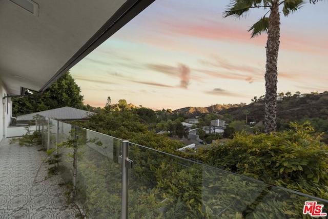 view of balcony at dusk