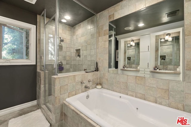 bathroom with separate shower and tub