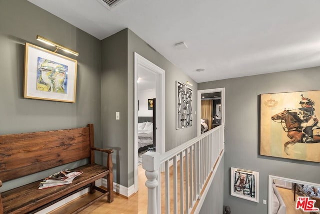 corridor featuring light hardwood / wood-style flooring