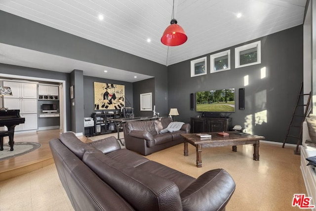 living room featuring high vaulted ceiling and wood ceiling