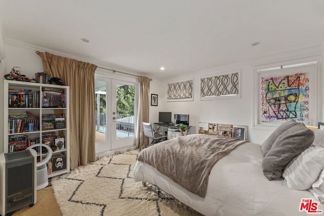 carpeted bedroom with access to outside, crown molding, and french doors