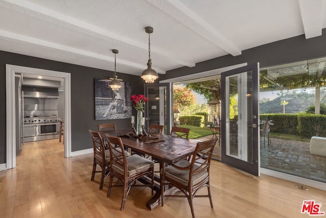 dining space featuring beamed ceiling, french doors, and light wood-type flooring