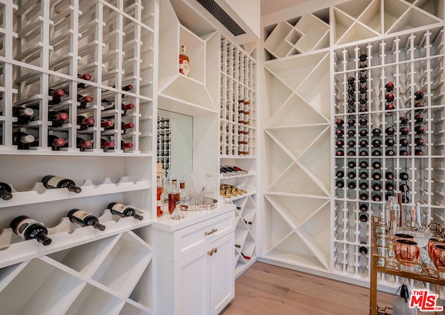 wine area featuring light wood-type flooring