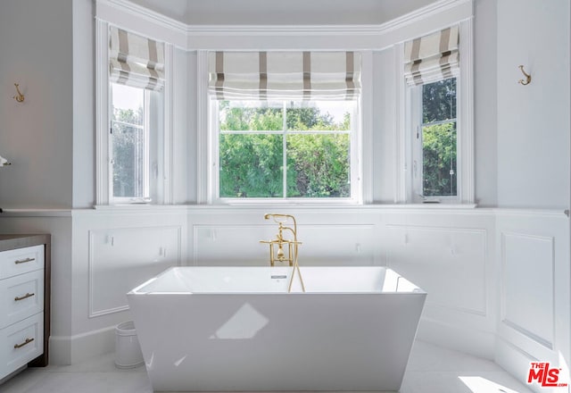 bathroom featuring a bath and a healthy amount of sunlight