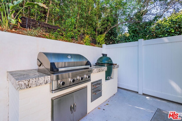 view of patio / terrace featuring area for grilling and an outdoor kitchen