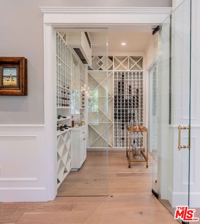 wine cellar featuring hardwood / wood-style flooring