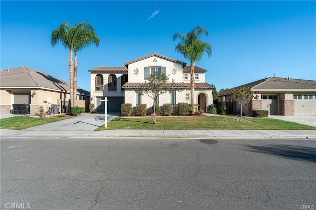 view of front of property featuring a garage and a front lawn