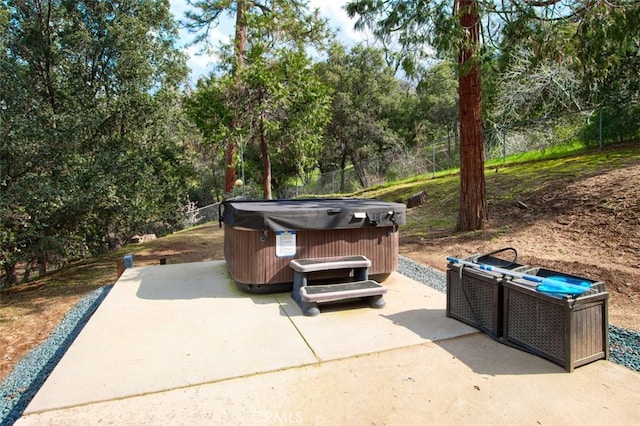 view of patio / terrace with a hot tub