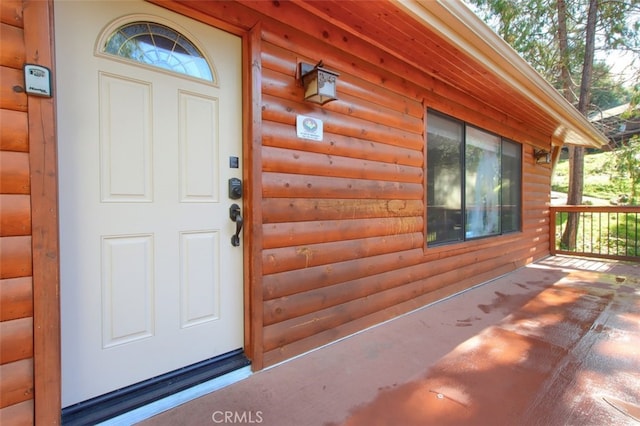 property entrance featuring covered porch