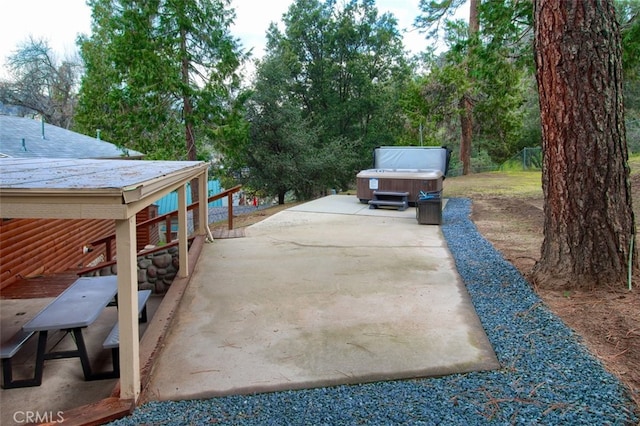 view of patio / terrace featuring a hot tub