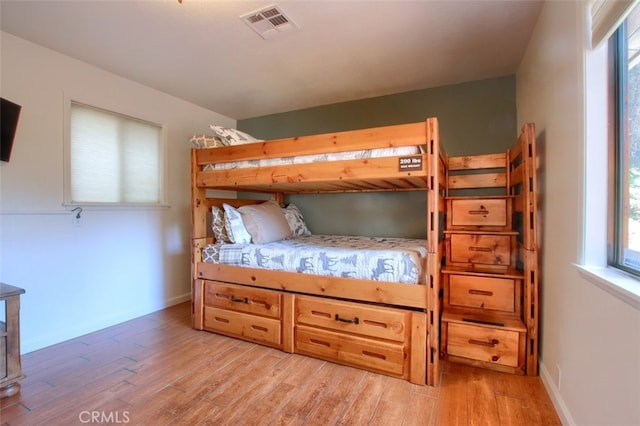 bedroom with light wood-type flooring