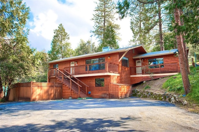 view of front of property with a wooden deck