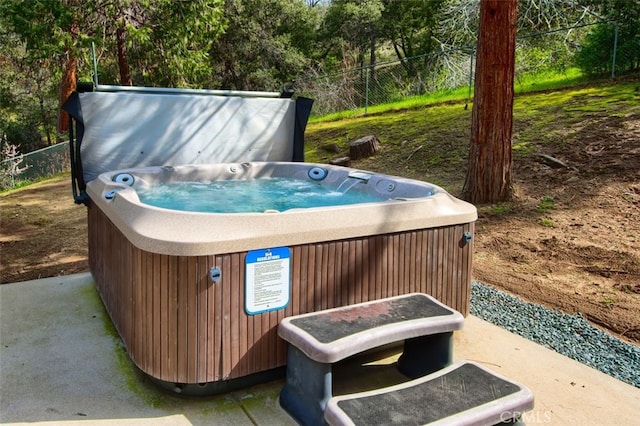 view of patio / terrace featuring a hot tub